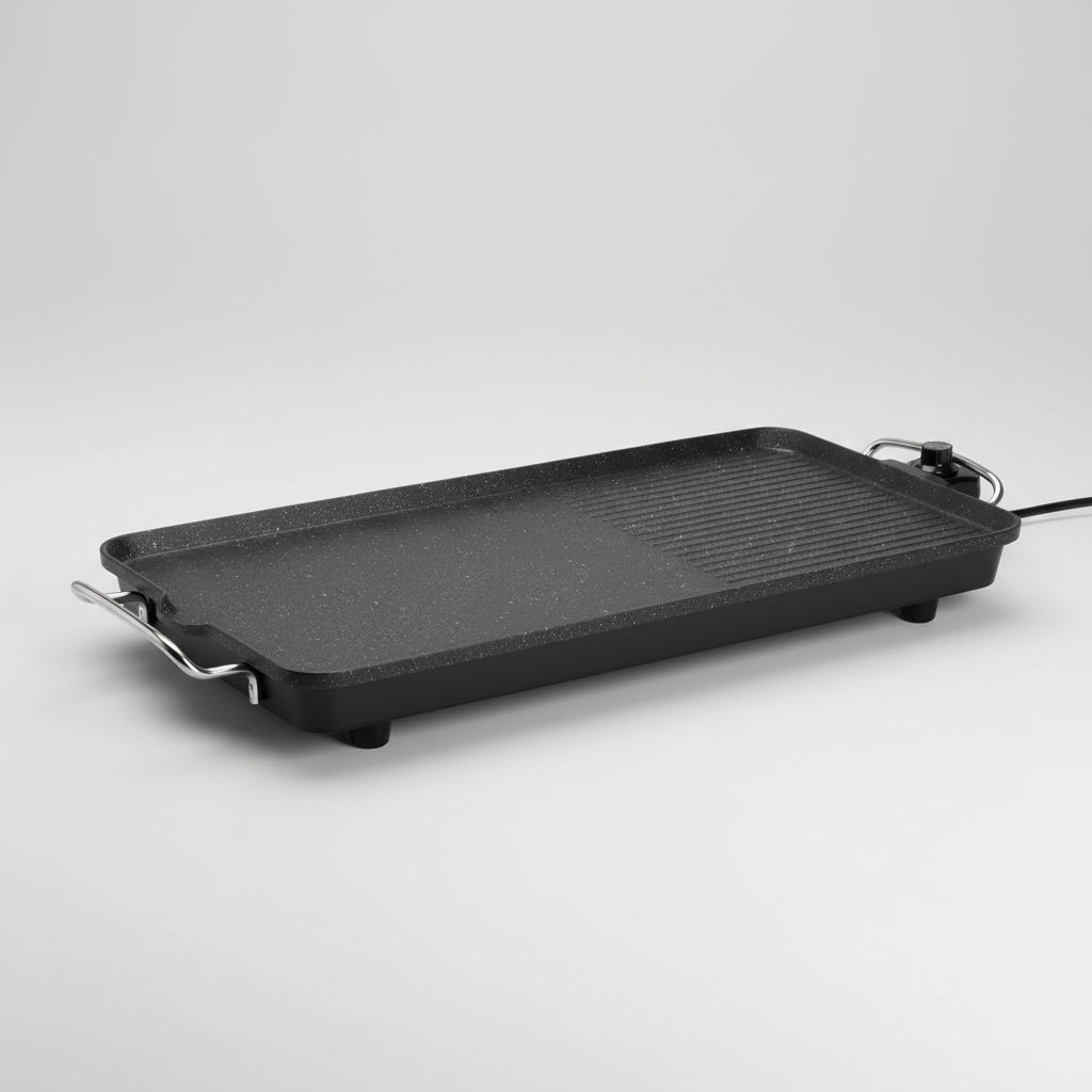 Rectangular black grill pan with handles on a white background