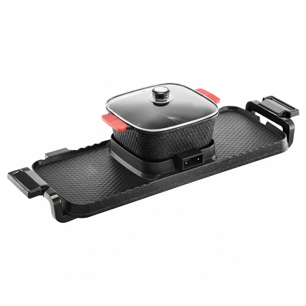Black electric cooktop with a pot on a white background