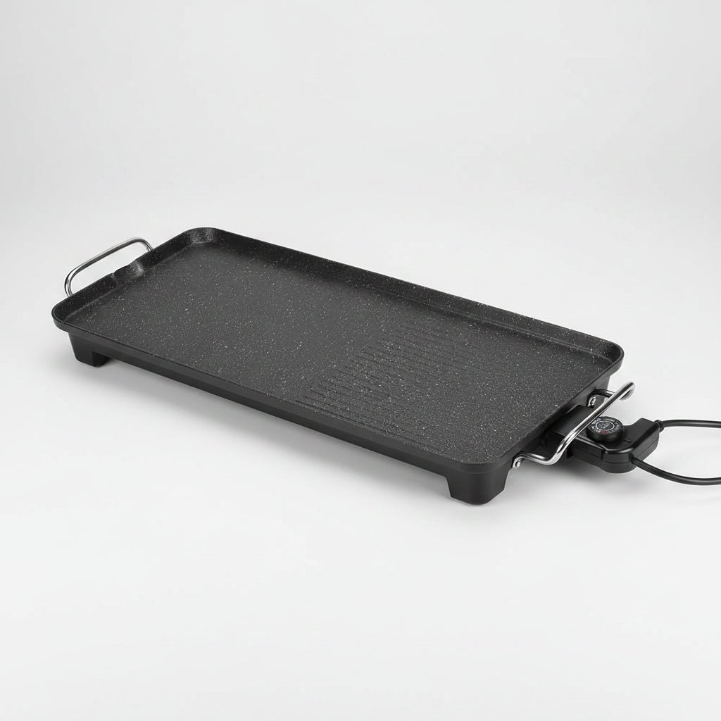 Rectangular black grill pan with handles on a white background
